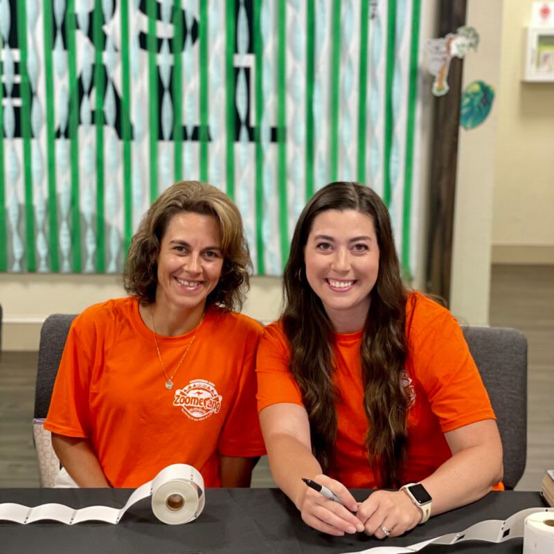 An image of workers helping children at Lighthouse Baptist Church's VBS in Theodore, AL.